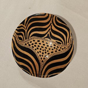 African handmade wooden bowl with intricate hand-painted design, ideal for serving or as a decor piece.