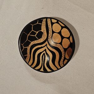 African handmade wooden bowl with a unique hand-painted pattern, perfect for serving or decorative purposes.