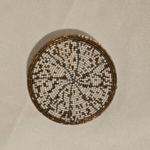 Handmade white and gold beaded coaster with intricate design, perfect for home decor