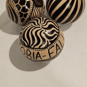 Hand-carved decorative calabash gourd balls with black and beige patterns
