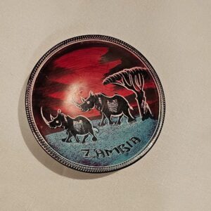 Hand-painted African coaster bowl with rhino design and Zambia inscription