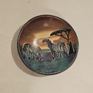 Hand-painted African wooden bowl featuring zebras at sunset.