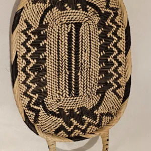 African Handmade Woven Basket with lid, crafted from natural fibers like raffia and straw.