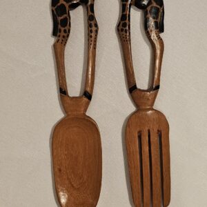 Hand-carved wooden serving spoons with giraffe-shaped handles.