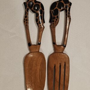 Handcrafted wooden serving spoons with giraffe-shaped handles, made from rich dark wood for a unique kitchen or dining piece.
