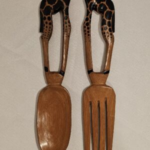 Hand-carved wooden serving spoons with giraffe-shaped handles, crafted from dark wood, perfect for kitchen or dining decor.