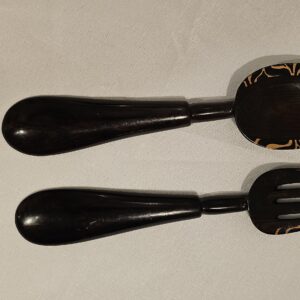 Handcrafted wooden serving utensils with unique designs, perfect for adding a touch of elegance to your dining experience.